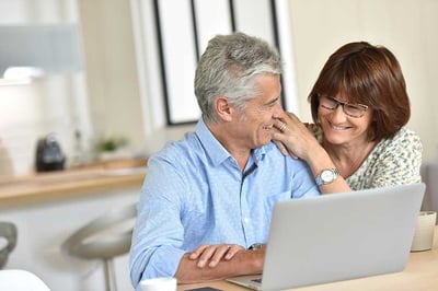 couple-using-laptop-computer